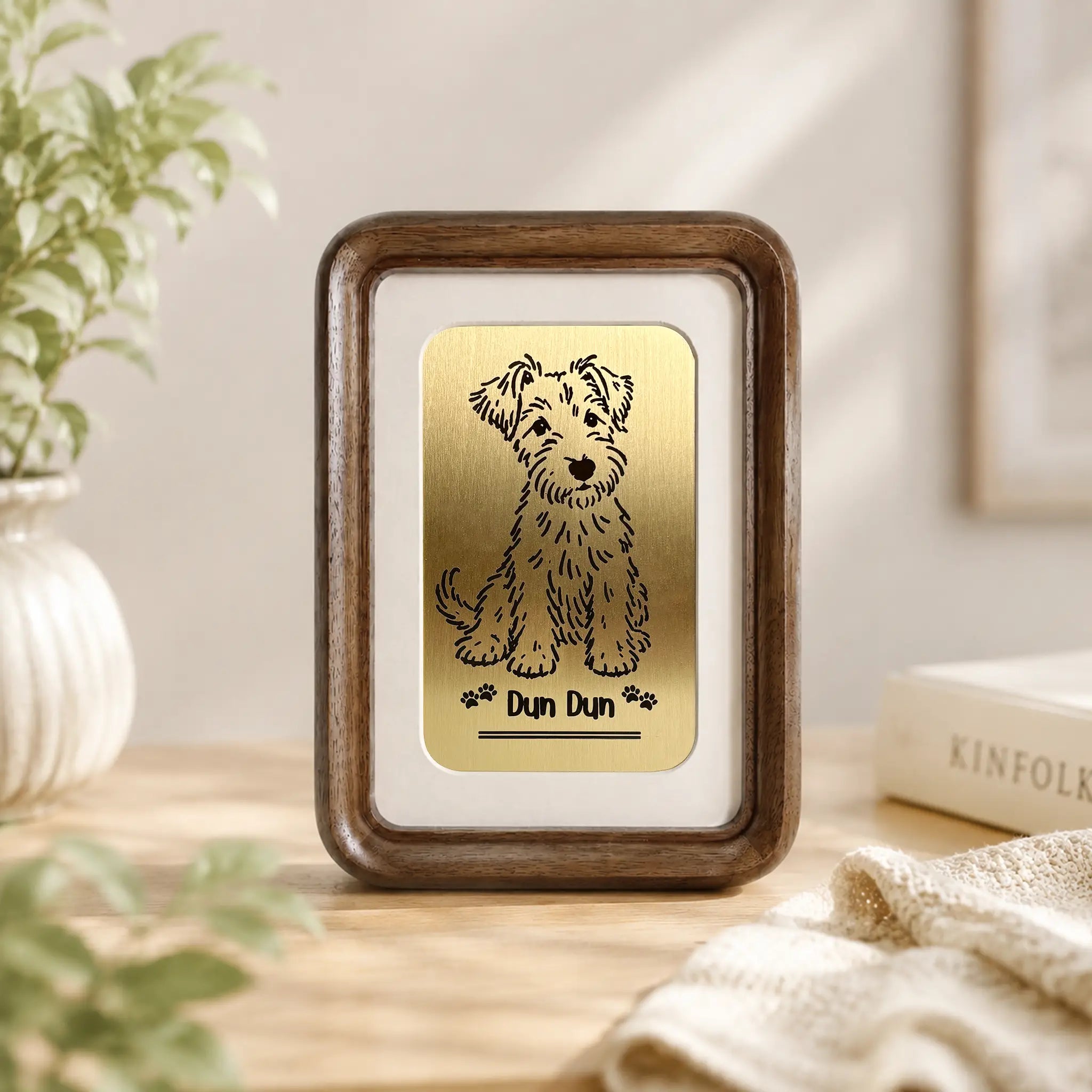 Personalized dog line art engraved on a brass plate in a walnut frame with the pet's name