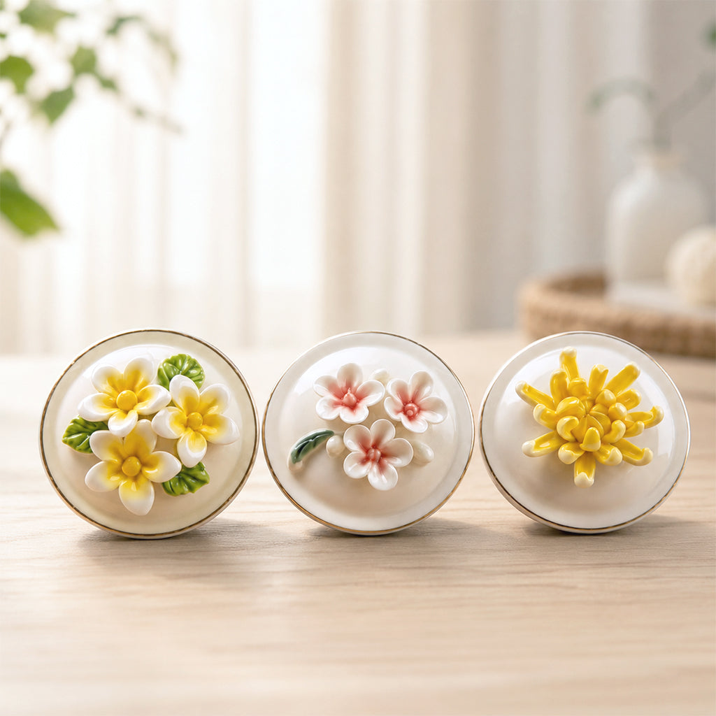 White and pink ceramic pet urns with floral lids displayed side by side showing color and flower options