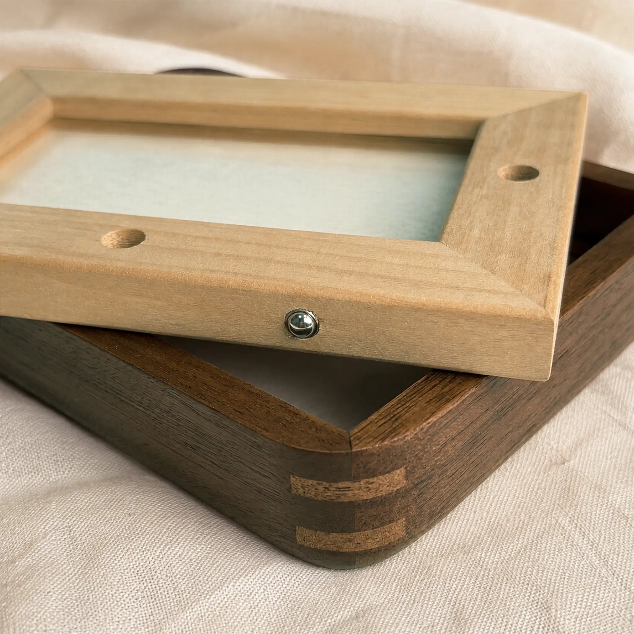 Walnut frame opened to show the removable back and replaceable engraved brass plate